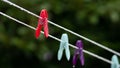 Close up of a red clothes peg on a line in the rain Royalty Free Stock Photo