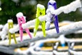 Colourful Clothes Pegs in Snow Royalty Free Stock Photo