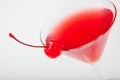 Colourful coctail with cherry on the black background