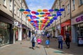 Colourful collection of open hanging umbrellas art installation in Bath