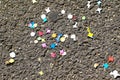 Colourful confetti on the ground after carnival. Confetti on the ground after the holidays. Background.