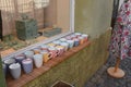 Colourful cups and mugs exposed for sale in window-sill of the small corner shop Royalty Free Stock Photo