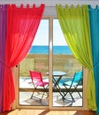 Colourful Curtains and Window with Sea View Royalty Free Stock Photo