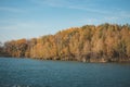 Colourful deciduous forest shimmers above the surface of Kalisovo Lake near BohumÃÂ­n in the eastern part of the Czech Republic. Royalty Free Stock Photo