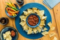 A Colourful Display Of Authentic Mexican Tortilla Chips And Gourmet Salsa.