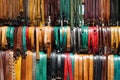 Colourful display of belts in market