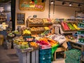 Colourful displays of fresh fruit and vegetables by green grocers in the new Market Hall in Preston, Lancashire, UK