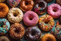 Colourful Donuts background. Top view of assorted glazed donuts.