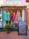 Colourful dress shop window at Christmas