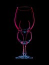 Colourful drinking glasses on black, dark field photography.