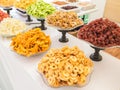 Colourful dry fruit for sale in display dishes. Royalty Free Stock Photo