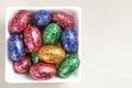 Colourful easter eggs in white bowl Royalty Free Stock Photo