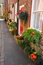 Colourful English floral village of Croston with flower baskets. Royalty Free Stock Photo