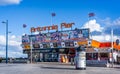 Colourful entrance to Britannia Pier with posters advertising coming shows in Great Yarmouth, Norfolk