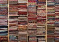 Colourful fabric, textile and silk on wooden shelf in fabric store