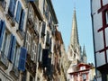 Colourful facades built in classical French Basque tradition seen from narrow street in Bayonne, France