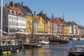 Colourful facades, old ships and crowd of tourists along the Nyhavn Canal in Copenhagen city