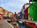 Green and purple facades stand out in the this Burano picture