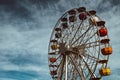 Colourful ferris wheel in the amusement park Tibidabo on background of blue sky