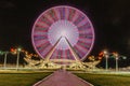 A colourful ferris wheel at night. Front view. Big carousel in Baku. Night fun. Ferris wheel against a dark sky background. Ferris Royalty Free Stock Photo