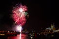 Colourful firework in front of the cathedral of Cologne