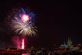 Colourful firework in front of the cathedral of Cologne