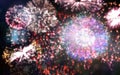 Colourful fireworks exploding on black background