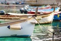 Colourful fishing boats in small marina of Vernazza, one of the five centuries-old villages of Cinque Terre, located on rugged Royalty Free Stock Photo