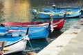 Colourful fishing boats in small marina of Vernazza, one of the five centuries-old villages of Cinque Terre, located on rugged Royalty Free Stock Photo