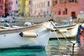Colourful fishing boats in small marina of Vernazza, one of the five centuries-old villages of Cinque Terre, located on rugged Royalty Free Stock Photo