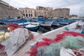 Colourful fishing nets in the harbour in Gallipoli, Puglia Italy. Plastic fishing nets can be polluting and a danger to sea life.