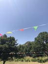 Colourful flags in a green park