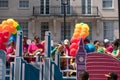 Colourful float with people on board and decorated with balloons, on Regent Street during the Gay Pride Parade 2018 in London.