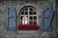 Colourful flower bed and decorative window of the restaurant, Namur, Belgium Royalty Free Stock Photo