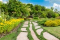 Colourful Flowerbeds and Winding Grass Pathway