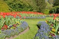 Colourful Flowers and Lawn Pathway in a Formal Garden Royalty Free Stock Photo