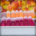 Colourful fresh fruit drinks for sale at food markets Royalty Free Stock Photo