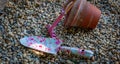 Colourful garden tools with terracotta clay flower pots on a gravel background Royalty Free Stock Photo