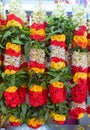 Colourful garland hanged and sold in an India stall nearby a temple Royalty Free Stock Photo