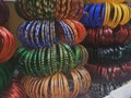 Colourful glass bangles close up. Bangles neatly stacked in a shop