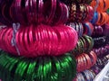 Colourful glass bangles close up. Bangles neatly stacked in a shop