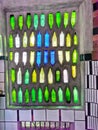 Colourful glass bottles on a window in the Hundertwasser public toilet in Kawakawa town in New Zealand