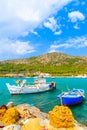 Colourful Greek fishing boats with nets on shore in Posidonio bay, Samos island, Greece Royalty Free Stock Photo