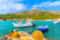 Colourful Greek fishing boats with nets on shore in Posidonio bay, Samos island, Greece Royalty Free Stock Photo