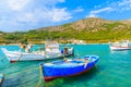 Colourful Greek fishing boats on turquoise sea in Posidonio bay, Samos island, Greece Royalty Free Stock Photo