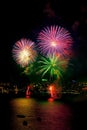 4 Colourful green firework explode on popular beach