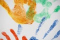 Colourful Handprints of various sizes on canvas Royalty Free Stock Photo