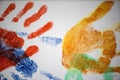 Colourful Handprints of various sizes on canvas Royalty Free Stock Photo