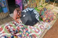 Colourful handicrafts are being prepared for sale in Pingla village by Indian rural woman worker. Royalty Free Stock Photo