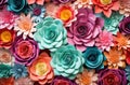 Colourful handmade paper flowers on background